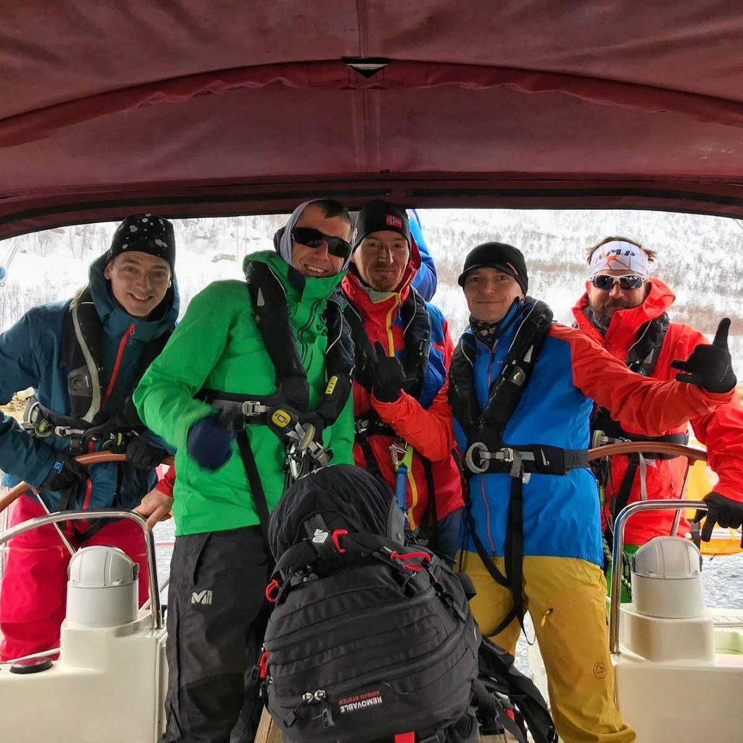 Happy group of skiers sailing