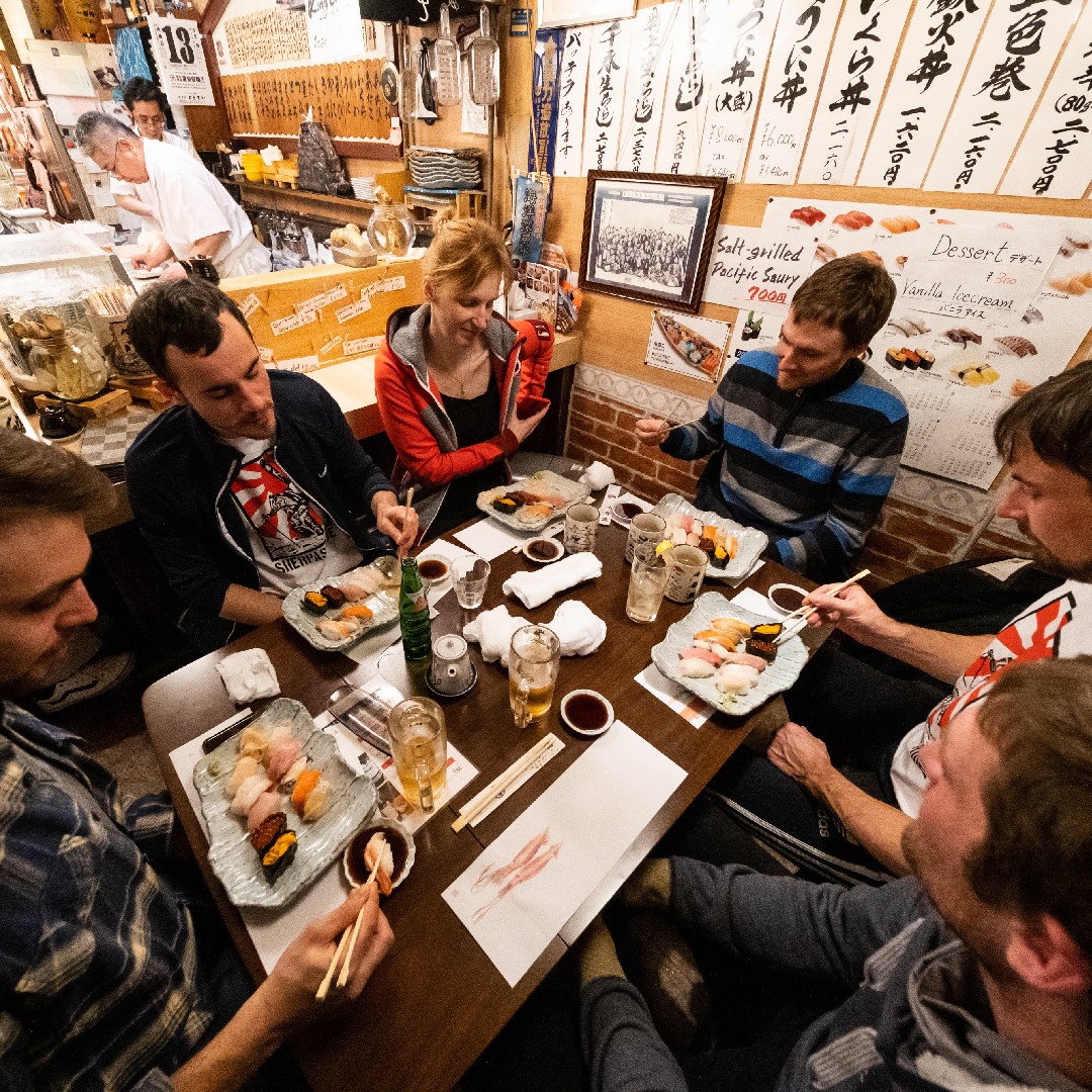 Group of freeriders eating sushi in Niseko