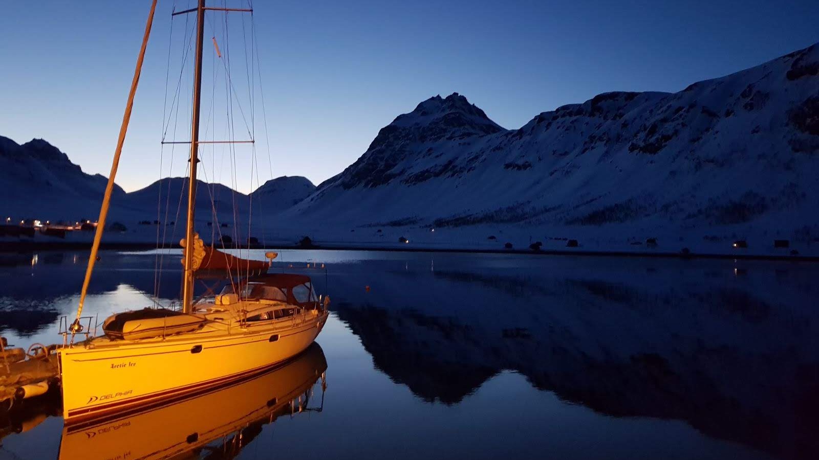 11Sail boat anchoring in the fjord in front of Lyngen Alp peaks