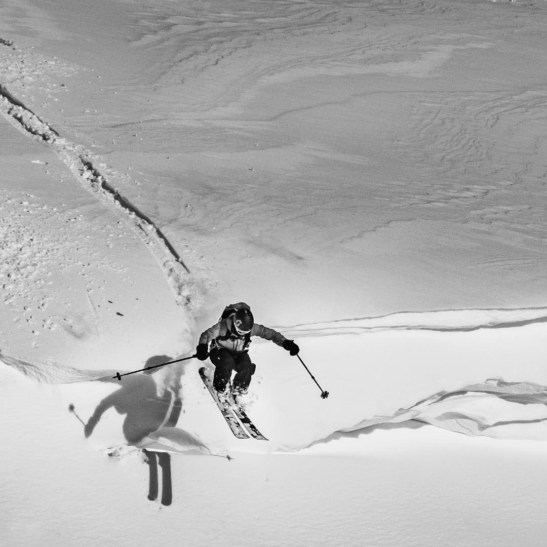 Skier dropping a cornice in Hokkaido backcountry