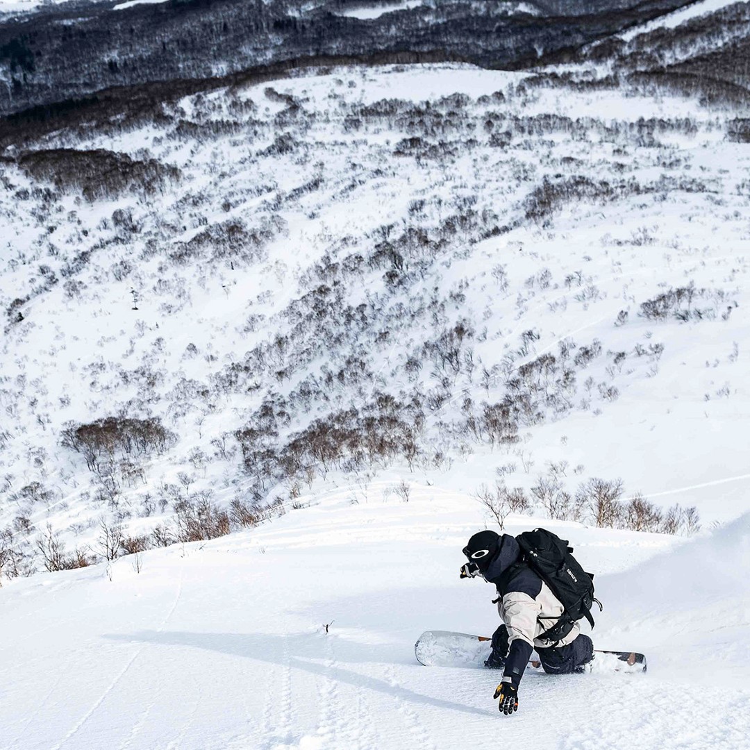 Snowboarder making a turn in Japanese powder