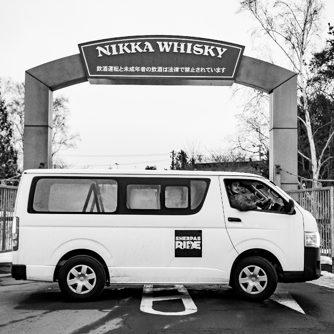Toyota Hiace van parked infront of Nikka Whisky distillery on Hokkaido