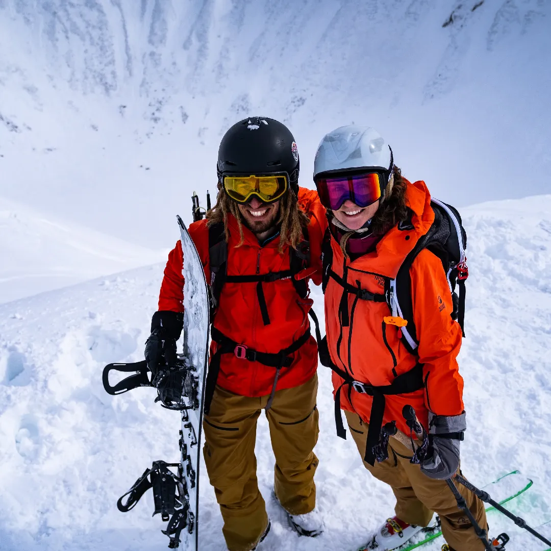 Splitboarder and skier girl on top of Mount Yotei